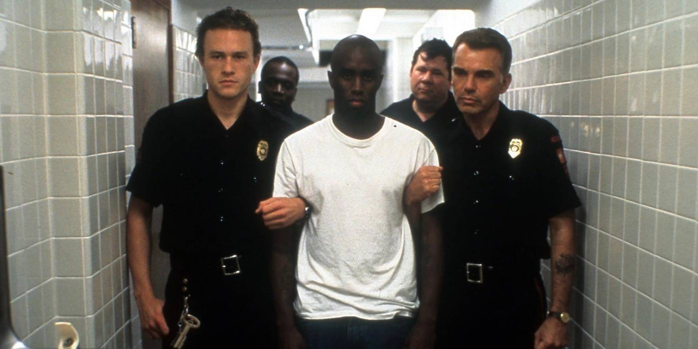 Сонни и Хэнк идут по коридору вместе с Лоуренсом и другими офицерами.