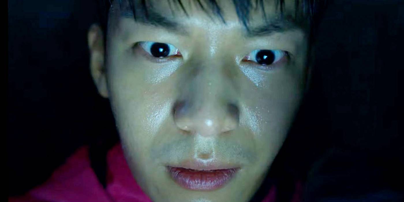 Крупный план Ви Ха-Джуна в роли Джун-Хо из первого сезона «Игра в кальмара»