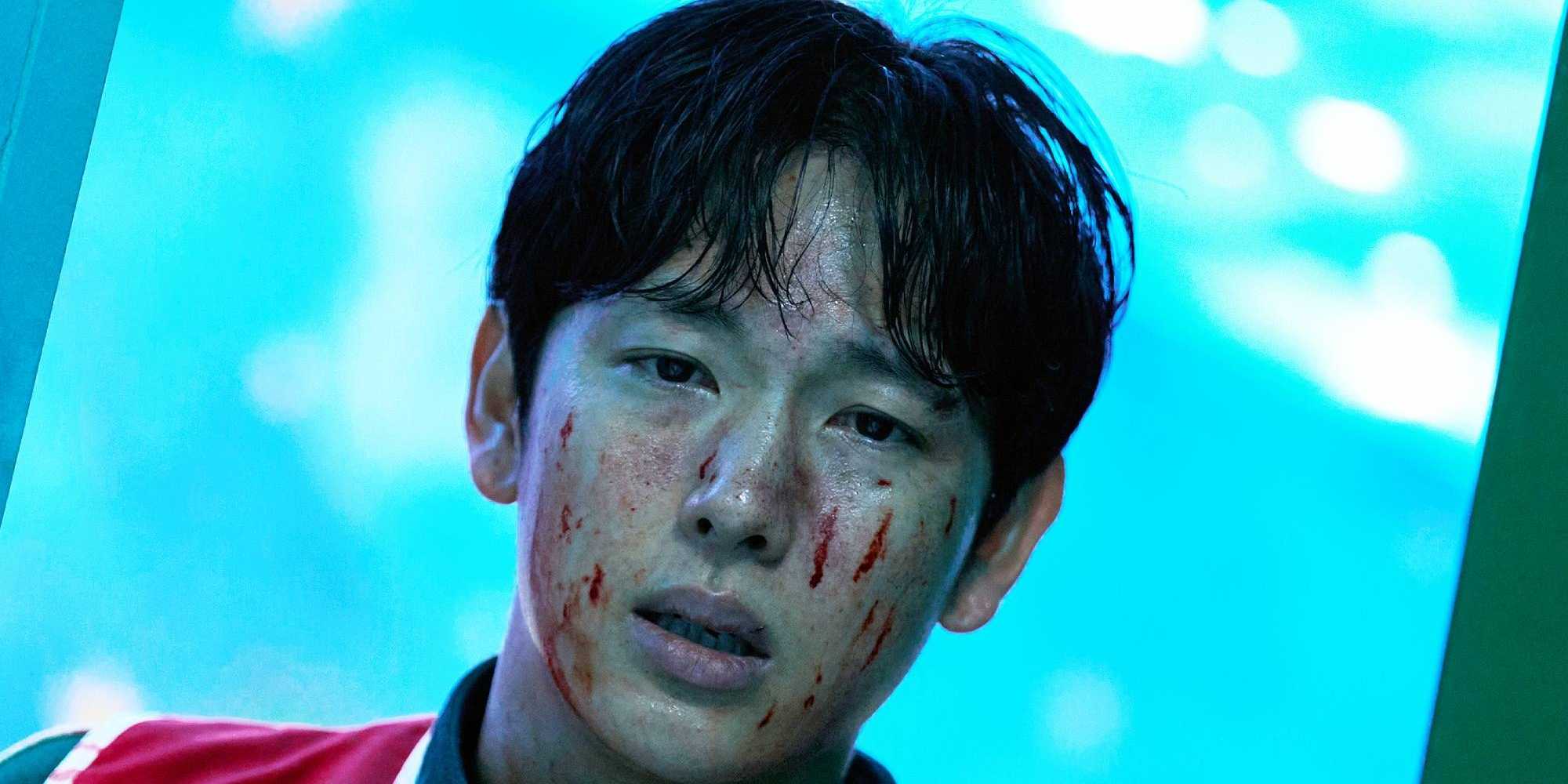 Мён-ги с окровавленным лицом, смотрящий вдаль, в 3 сезоне "Игры в кальмара"