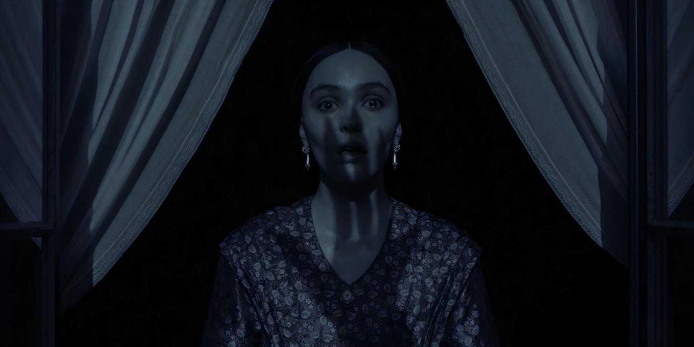 Изображение из "Носферату", где женщина стоит у окна