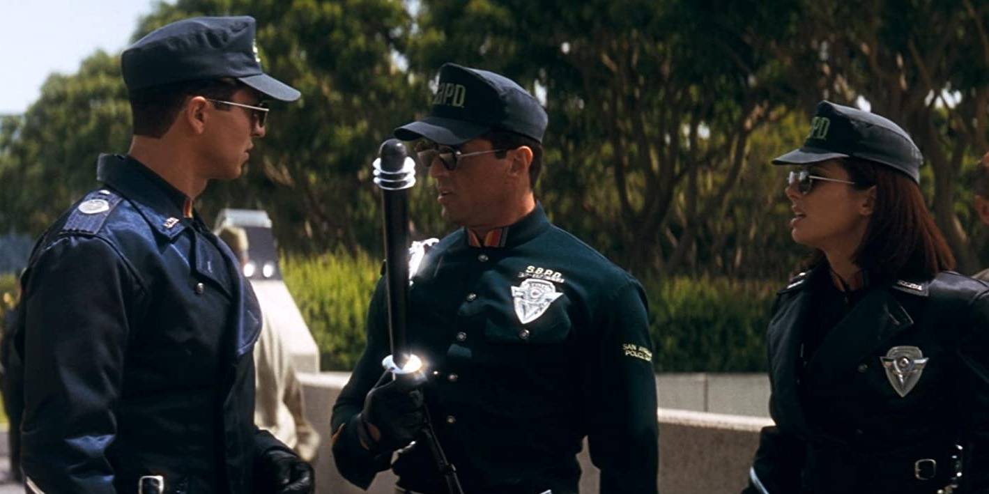 Сандра Буллок, Сальваторе Старрон и Бенджамин Братт в фильме "Демолитор" (1993)