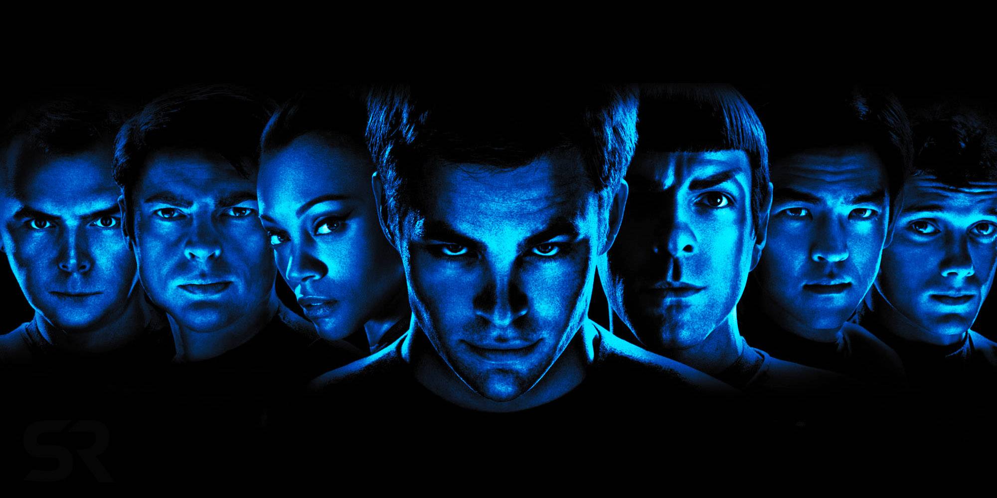 Актеры фильма *Star Trek* (2009) стоят вместе для рекламной фотографии на черном фоне с синим фильтром на их лицах.